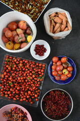 Autumn harvest from your own garden laid out in different bowls on the background