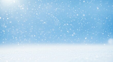 Falling snow against a clear blue sky with a pristine layer of snow on the ground creating a serene winter scene