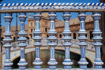 Decorative blue and white balustrade in Seville, Spain, with ornate architectural details
