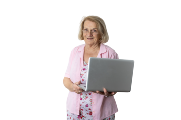 Senior woman holding laptop smiling at camera