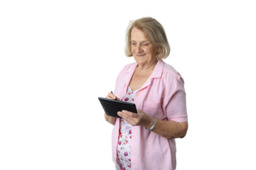 Elderly woman learning digital technology using tablet and stylus