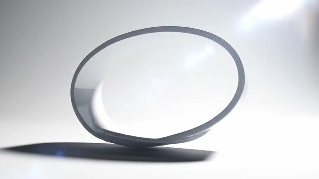 Abstract Metallic Mobius Strip Rotating Seamlessly in Studio.
