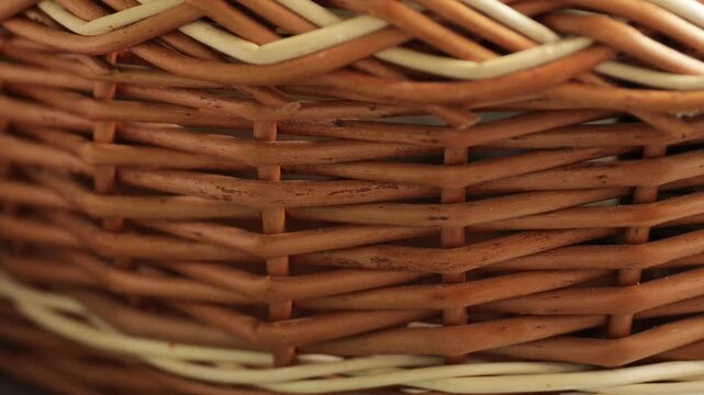 A close-up shot of a traditional wicker basket sitting on a table