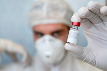 Blank label for your text and design on the bottle with the liquid. Scientific development of vaccines in the laboratory. Testing of vaccines. concept of laboratory research.