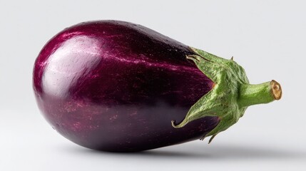Single glossy purple eggplant on a pristine white background â€” studio product photography