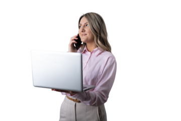 Businesswoman talking on phone and holding laptop