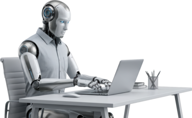 A humanoid robot with blue eyes and metallic limbs sits at a white desk typing on a silver laptop computer with a white mouse beside it artificial intelligence ai