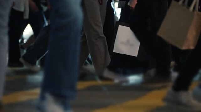 Tourists And Citizens Walking In Hong Kong Crosswalk At Night. Bustling Hong Kong Crosswalk Pulsing With Energy As Diverse Crowds Traverse Intersection, Illuminated By City Lights During Vibrant