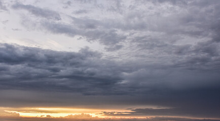 Serene sunset sky blending warm colors with gently subdued afternoon light