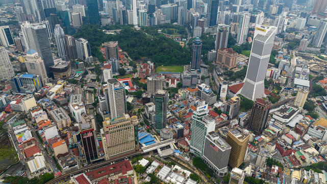 Fototapeta Kuala Lumpur, Malaysia - September 11, 2022: Aerial drone of capital of Malaysia is the city of Kuala Lumpur with skyscrapers and high-rise buildings.