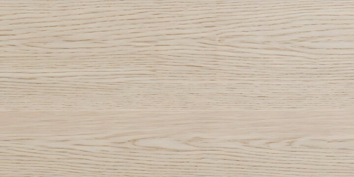 Close-up view of a pale, natural wood grain texture with subtle lines and a smooth surface, showcasing the organic pattern of the material