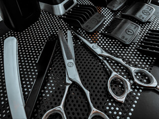 Professional Barber gear displayed on a dark matte surface