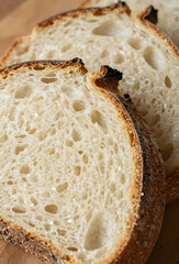 Fresh sourdough slices with airy crumb close up