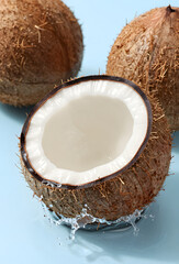 Freshly cracked coconut with splashing coconut water