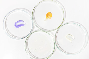 Cluster of Petri dishes with cosmetic liquid smears