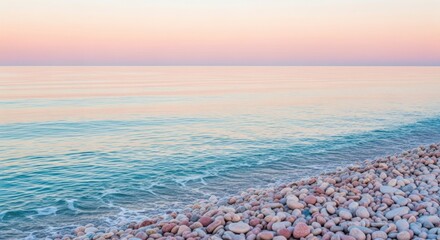 Serene beach sunrise with calm waves and pebble shoreline landscape
