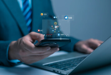 businessman using a smartphone with floating social media icons illustrates digital marketing engagement, online interaction, audience analytics, and modern communication in a technologydriven.