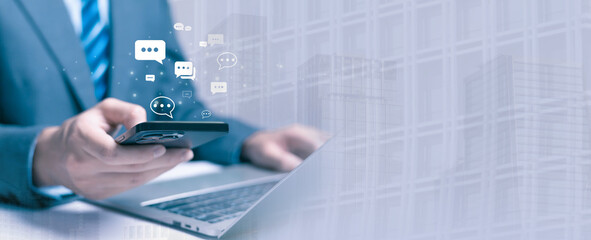 businessman using a smartphone with floating chat icons represents online communication, digital messaging, real-time interaction, and modern corporate connectivity in a technology-driven workplace.