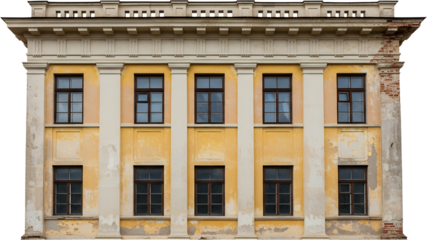 Old yellow building facade with rows of windows architectural detail and visible brickwork on the right side Architecture