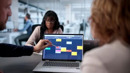 Team In Corporate Meeting With Calendar