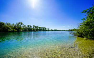 View of the Langwieder lake district and the surrounding landscape. Nature by the lake near Munich in Bavaria.
