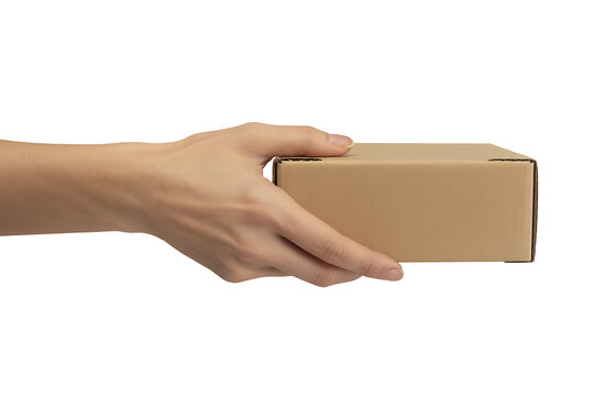 A persons hand extends horizontally, holding a small, plain brown cardboard box, isolated on white background