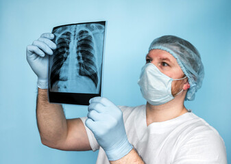 Tuberculosis. Lungs' cancer. A medical worker in uniform takes an x-ray of the lungs, a doctor examines pneumonia