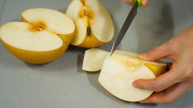  Cut a pear. Asian pears, nashi pear, organic fruit and vitamin nutrition