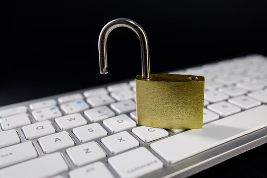 Cyber security concepts with a padlock on a keyboard during a digital event