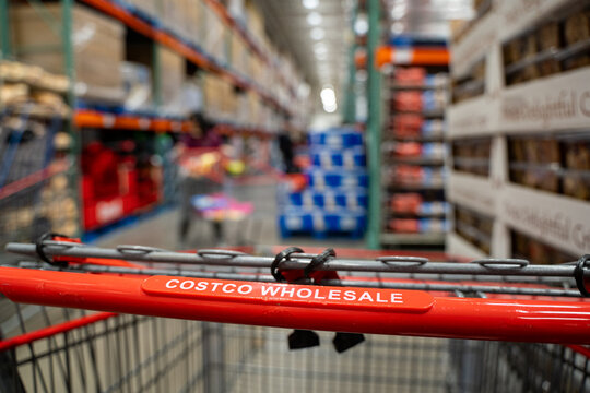 Close up of Costco Wholesale shopping cart inside warehouse aisle. Toronto, Canada - December 3, 2025.