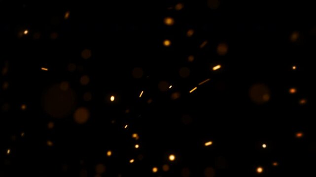 golden sparks flicker, warm metallic particles shimmer against night background