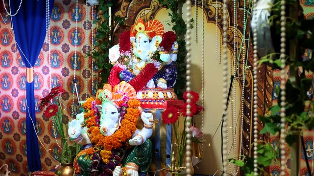 Ganesha idols adorned with garlands celebrating Ganesh Chaturthi festival in India