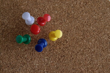 push pin on a wooden background