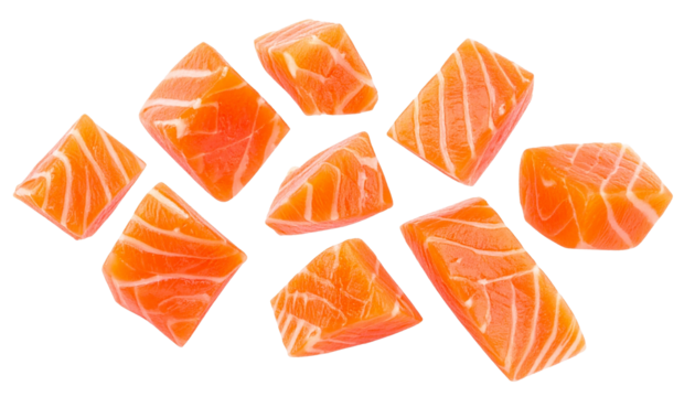 Vibrant raw salmon chunks scattered, perfect for culinary preparation on a clean white background