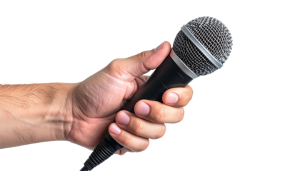 Hand holding a classic microphone ready for a performance or interview