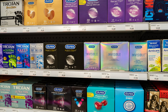 View of assorted condom products on pharmacy shelf. Toronto, Canada - December 3, 2025.