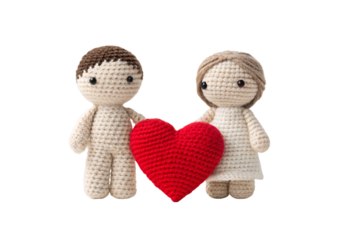 Two crocheted figures holding red heart between them, handmade couple, isolated on a transparent background