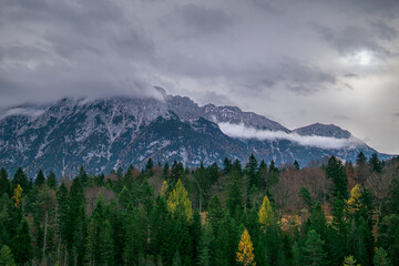 Blue mountain landscape with forest and fog in Bavaria Germany