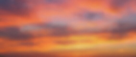 Obraz premium Vintage Style Blurry Grainy Sunset Sky Background with Soft Orange, Purple and Pink Cloud Layers Creating Dreamy Retro Atmosphere for Abstract Landscape, Mood and Texture Projects. Panoramic bg