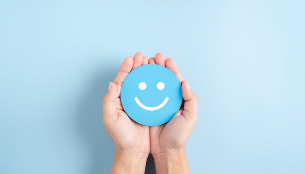 Hand holding blue paper cut happy smile face, Positive thinking, Mental health assessment, World mental health day concept with copy space