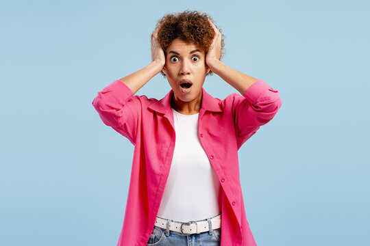 Shocked African American woman reacting to unbelievable news or event