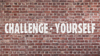 Inscription &laquo;Challenge yourself&raquo; on old brickwork