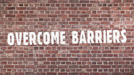 Inscription &laquo;overcome barriers&raquo; on old brickwork