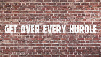 Inscription &laquo;get over every hurdle&raquo; on old brickwork