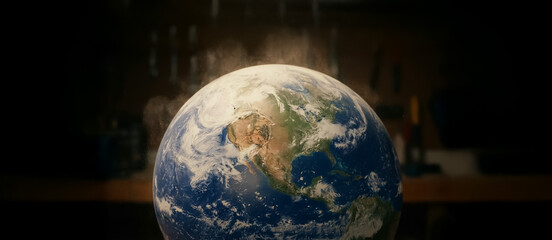 Illuminated globe resting on a dark surface with fine dust rising around it, creating a dramatic atmosphere that evokes global fragility, environmental change, and planetary awareness.