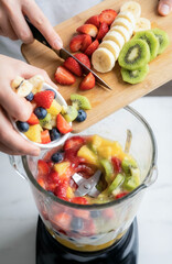 Freshly chopped fruit being added into a blender as vibrant ingredients swirl together, capturing the energy of preparing a colorful, healthy smoothie packed with natural vitamins and flavors.