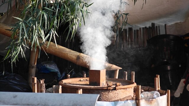 Smoke from Traditional Way of Charcoal Production. - Powered by Adobe