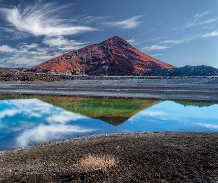 The Atlantic coast of Lanzarote. Montana Bermeja beach and Lago Verde lake. A beautiful volcanic landscape.