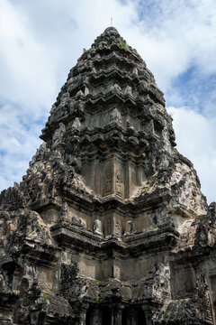 Angkor Wat temple tower against a cloudy sky in Siem Reap, Cambodia