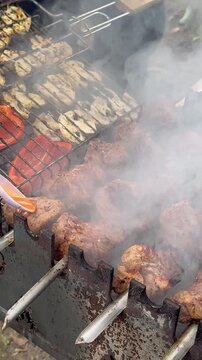 Tasty Charcoal-Grilled Meat With Veggies On Rack